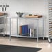 A Steelton galvanized steel undershelf for a work table with cutting boards on it.