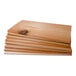 A stack of Wildwood Grilling cedar wood planks.