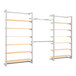 A white wall-mount retail display with shelves, a hangrail, and faceouts.