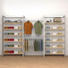 A room with a wall-mount retail display with shelves, clothes, and toys on it.