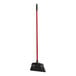 A red and black Libman commercial angle broom with a long handle.