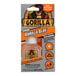 A plastic bottle of Gorilla Glue with a label on it.