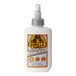 A white bottle of Gorilla 4 oz. clear wood glue with a silver cap.