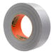 A roll of Gorilla grey duct tape with orange and black stickers.