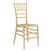 A gold Lancaster Table & Seating chiavari chair.