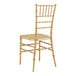 A Lancaster Table & Seating gold chiavari chair with steel reinforcement.