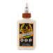 A white bottle of Gorilla Ultimate 4 oz. Wood Glue with a brown cap.