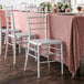 Lancaster Table & Seating silver chairs on a table with a pink tablecloth.