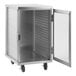 A stainless steel Regency sheet pan rack cabinet with a clear door open.