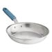 A Vigor aluminum frying pan with a blue silicone grip.