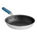 A close-up of a Vigor 10" aluminum frying pan with a blue silicone grip.