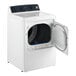 A white GE front load gas-powered commercial dryer with the door open.