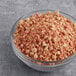 A bowl of Yum Crumbs Maple Bacon crumb topping on a table.