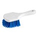 An O-Cedar blue utility brush with white bristles.