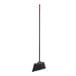 A black broom with a long black pole.