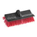 A red and black O-Cedar floor scrub brush head.