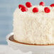 A white cake with Coral Bay sweetened coconut flakes on top.