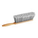 An O-Cedar counter duster with grey bristles.