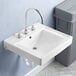 A close-up of a white American Standard Decorum wall-mount sink with silver faucets.