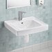 An American Standard white wall-mount bathroom sink with a faucet above it.