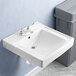 A white American Standard Decorum wall-mount sink over a drain with a trash can next to it.