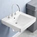 A white American Standard Decorum wall-mount sink with silver faucets over it.