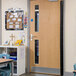 A classroom door with L.A. Baby black dual shield finger guards.