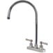 A chrome Advance Tabco deck-mounted faucet with lever handles and a gooseneck nozzle.