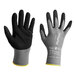 A pair of grey gloves with black palm-dipped and knit wrist.