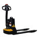 A black and yellow Big Joe electric pallet truck with a handle.