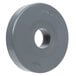 A grey circular Metro logo on a white oval object.