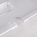 A Vollrath clear plastic slotted cover on a food pan.