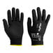 A close-up of a pair of black Ansell HyFlex gloves with a black nitrile palm coating.