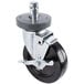 A black Metro Super Erecta rubber castor with a metal wheel and brake.