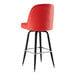 A Lancaster Table & Seating red vinyl barstool with black legs.