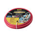 A close-up of a red Parker heavy-duty rubber air hose.