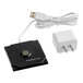 A black Zafferano America Poldina Pro table lamp charger with a white USB cable.