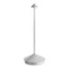 A white table lamp with a long silver pole and a white cone-shaped shade.