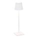 A small white cordless rechargeable table lamp with a square base and a conical shade.