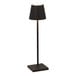A black cordless rechargeable table lamp with a square base and a conical shade.