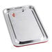 A silver stainless steel tray with a red silicone handle.