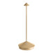 A Zafferano America Pina Pro gold table lamp with a metal base and pole with a yellow top.