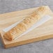 A Bridor ciabatta baguette on a wooden surface.