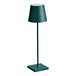 A Zafferano America Poldina Pro dark green cordless table lamp on a stand with a shade.