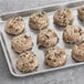 A tray of David's Cookies and Cream cookie dough on a gray surface.