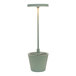 A sage green Zafferano America Poldina Pro table lamp with a light on a long pole.