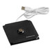 A black square USB charger with a white cable attached.