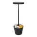 A black Zafferano America Poldina Pro cordless table lamp on a pole.