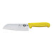 A Victorinox Santoku knife with a yellow handle.