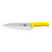 A Victorinox chef knife with a yellow Fibrox handle.